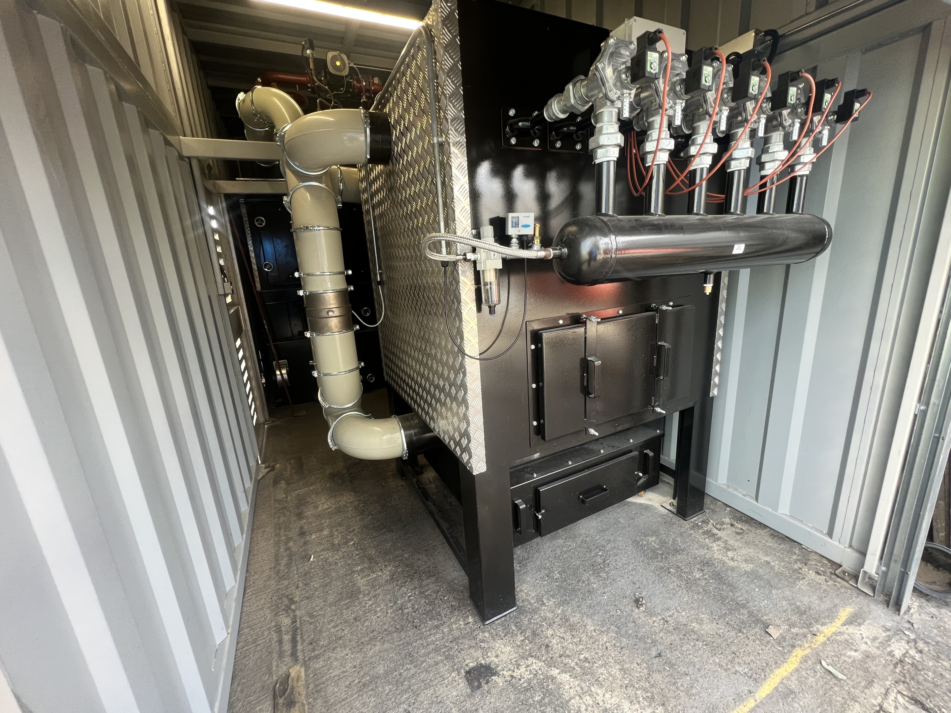 Ranheat ceramic filter installation inside container housing, showing modular design and compressed air cleaning system.